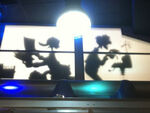 A silhouette of Ludwig and Gyro Gearloose in the Mouse Gear shop at the Disney Parks