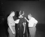 Geronimi and Marc Davis giving directions to Jane Fowler dressed as Maleficent.