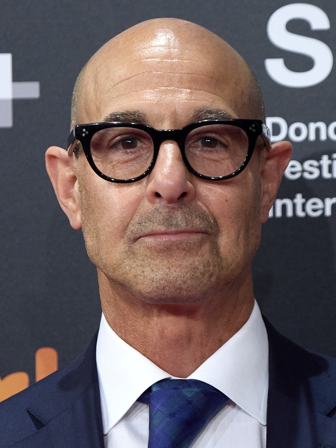 https://static.wikia.nocookie.net/disney/images/3/3f/Stanley_Tucci.jpg/revision/latest?cb=20231111142402