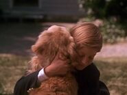 Peter lovingly hugging Shadow after playing basketball with him