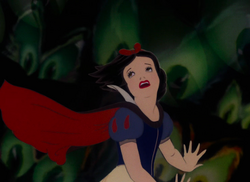 Snow White fleeing through the forest.