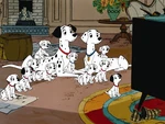 Pongo watches television with his family.