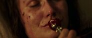 Belle's mother kissing the rose-shaped rattle before dying.