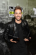 Prince Royce poses in the press room at the 2017 Latin American Music Awards.