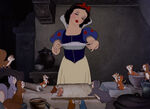 The Forest Animals watch Snow White bake a pie.