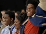Rondel, his teammates, and his mom cheering for Calvin and Tyco's victory at the trials