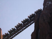 One of the trains ascending the main lift hill