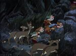 The Forest Animals watch the Dwarfs chase the Queen up a cliff.