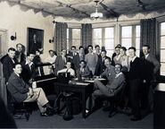 Standing from left: Edmond Seward, Frank Churchill, Otto Englander, Sharpsteen, Bert Lewis, Gilles "Frenchy" de Tremaudan, Clark, Rudy Zamora, Jackson, King, Tom Palmer, Cutting (behind Palmer), Cannon, Ferguson, Webb Smith Seated, from left: David Hand, Ted Sears, Lundy, Gillett, W. Disney
