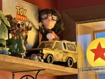 Lamplight Lounge A truck is located on a shelf with other Pixar collectibles.