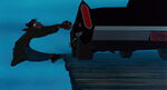 Fagin nearly falling off the pier from Sykes' car