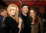 Kelly Preston with her husband John Travolta and his Look Who's Talking co-star Kirstie Alley at a social event in 2007.