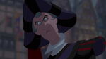 Frollo glaring at Quasimodo before sending him back into Notre Dame.