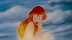 Ariel looking happy as her father turns her into a human