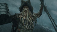 Davy Jones holding the chest before being shot by Jack Sparrow.