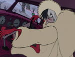 Cruella angrily rolls her car backwards