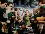 Robin and his men drinking to King Richard as they force the Sheriff to do so as well