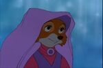 Maid Marian looks at Robin Hood after he put a lily-ring on her finger (subsequently with a firefly on it)