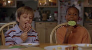 Noah and Henry eating lollipops