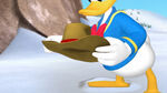 Donald holds a cowboy hat