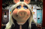 Miss Piggy gets annoyed at you for clicking the button and karate chops the screen.