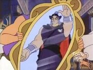 Aladdin holds a mirror in front of Kapok.