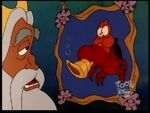 King Triton talking to his youngest daughter about Sebastian whose picture he sees.