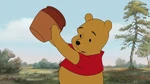 Winnie the Pooh is holding an empty honey pot