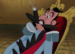 The Duke with cigars in his mouth.