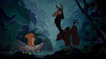 Kuzco throws the acorn at the squirrel's head.