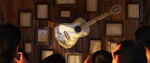 Héctor's guitar with his letters to Coco.