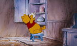 Winnie the Pooh is about to get the last bit in the honeypot