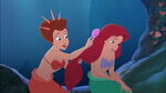 Attina brushing Ariel's hair.