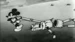 Mickey dragging his robot along