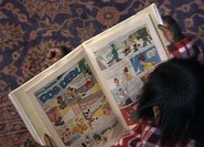 Stanley reads a Mickey Mouse comic book.