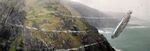 The Millennium Falcon rounding a bend on Ahch-To's Temple island in Star Wars: The Last Jedi.