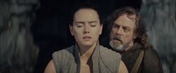 Rey being taught by a reluctant Luke Skywalker.