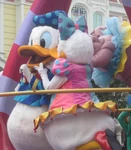 Donald getting smooched by Daisy in the Festival of Fantasy Parade.