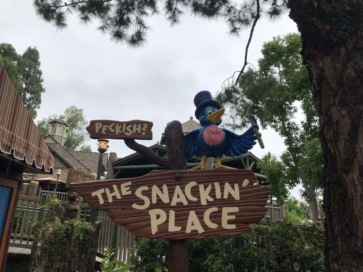 The Snackin' Place sign