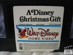 https://static.wikia.nocookie.net/disney/images/6/6e/A.disney.christmas.gift.vhs.clamshell.s.2a.JPG/revision/latest/scale-to-width-down/250?cb=20140903010132