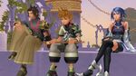 Aqua, Terra, and Ventus sitting of a ledge at the Land of Departure