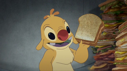 Leroy & Stitch - Reuben holding PBJ sandwich