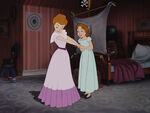 Wendy admiring her mother's party dress.