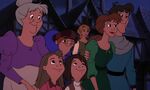 Madellaine and Quasimodo watching Clopin's puppet show