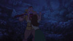 An angry Jane tries to stop Clayton, as he prepares to go after Tarzan.