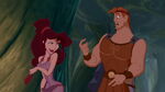 Hercules stammering around Meg.