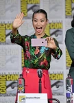 Jamie Chung takes an image of the audience, during the 2018 San Diego Comic Con.