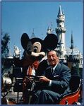 Walt driving around Disneyland with Mickey Mouse.