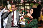 Neil Patrick Harris (pictured here with Mickey Mouse) hosted the Disney World segments starting in 2013.