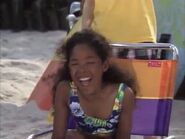 Sancha laughing at Goofy on his surfboard